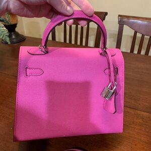 Brand new Absolutely stunning fuchsia real leather trendy purse size 25 w/ strap